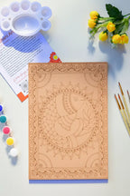 Madhubani fish mandala art kit styled on a wooden table - A4 pre-drawn board, 12 acrylic paint colors, brushes and palette for Indian folk art DIY painting - Arttykase