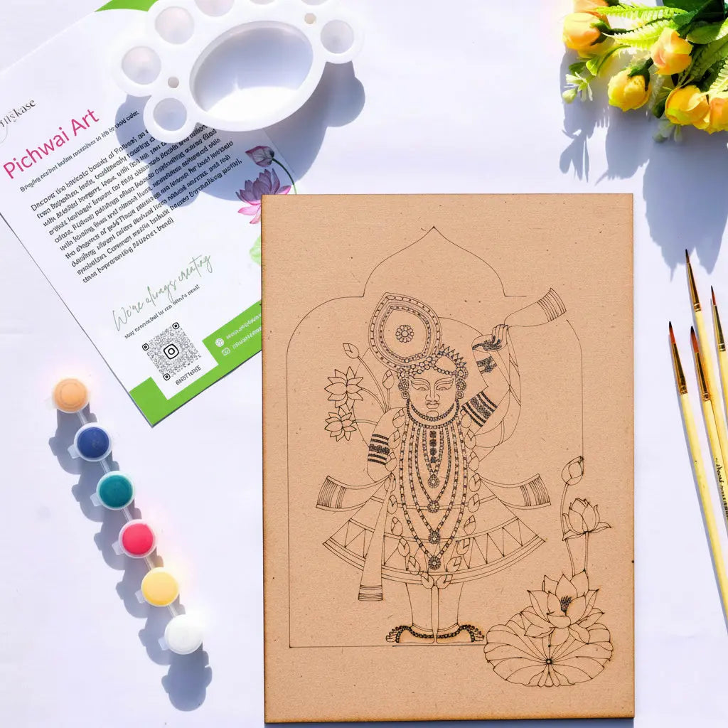 Arttykase Krishna Pichwai DIY art kit on white surface — pre-marked A4 board with sacred Lord Krishna lotus design, 6 acrylic paints, fine brushes and mixing palette