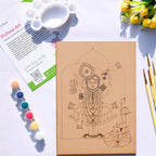 Arttykase Krishna Pichwai DIY art kit on white surface — pre-marked A4 board with sacred Lord Krishna lotus design, 6 acrylic paints, fine brushes and mixing palette