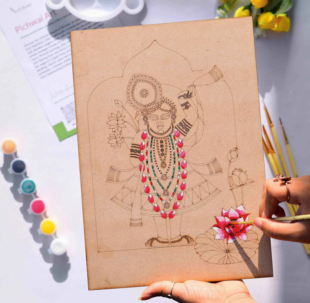 Person painting a Lord Krishna Pichwai devotional folk art design on an Arttykase pre-marked wooden board - sacred lotus motif Indian DIY art kit